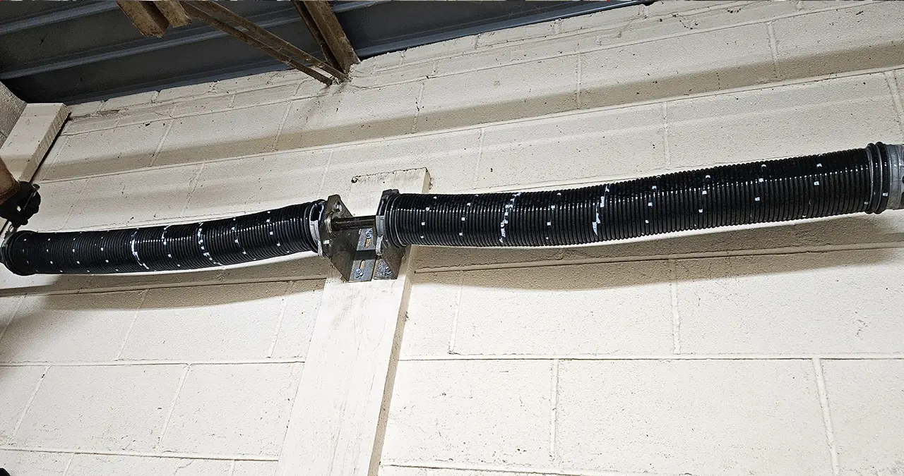 Firstline Garage Door Repair installed new springs for a wood garage door.