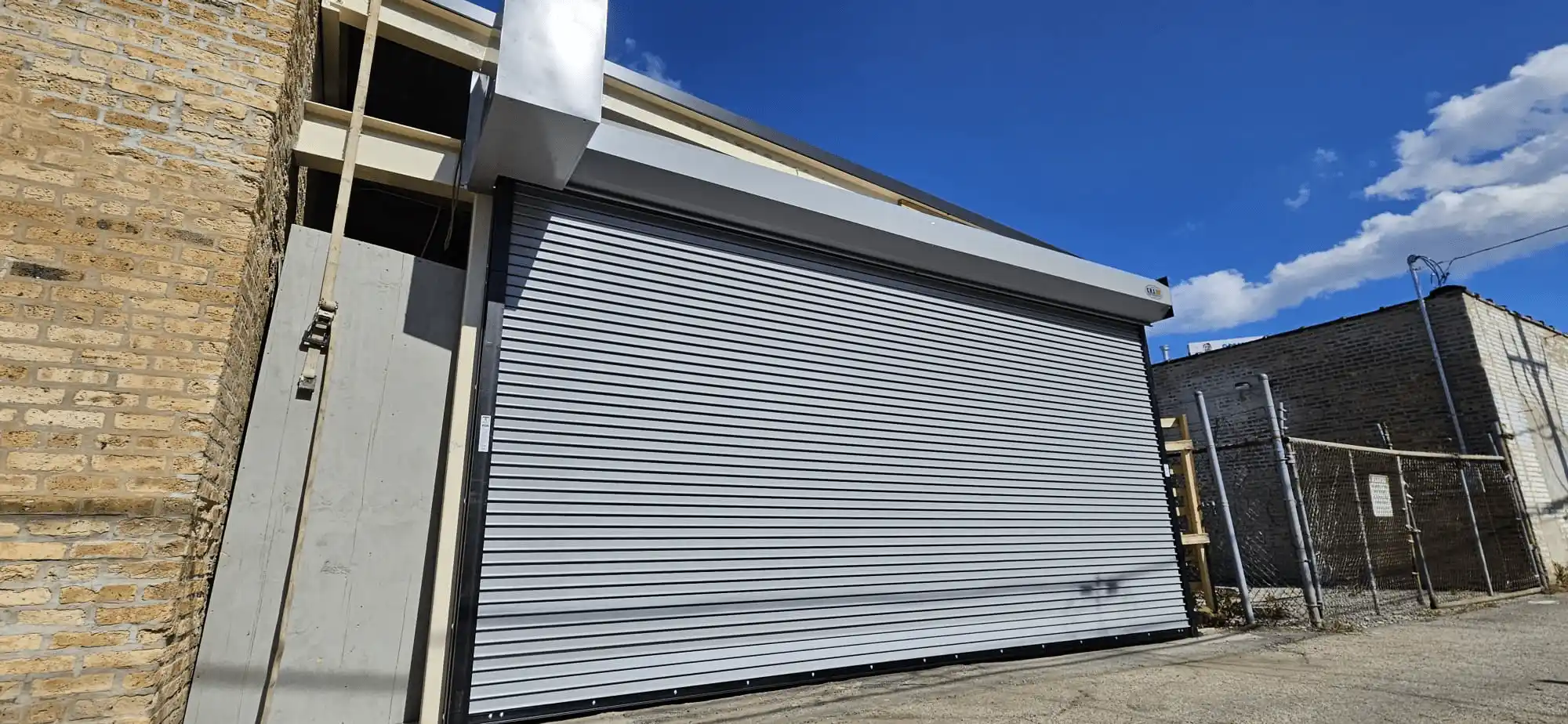 Installed New Rolling Door CHI With Commercial Opener Liftmaster.