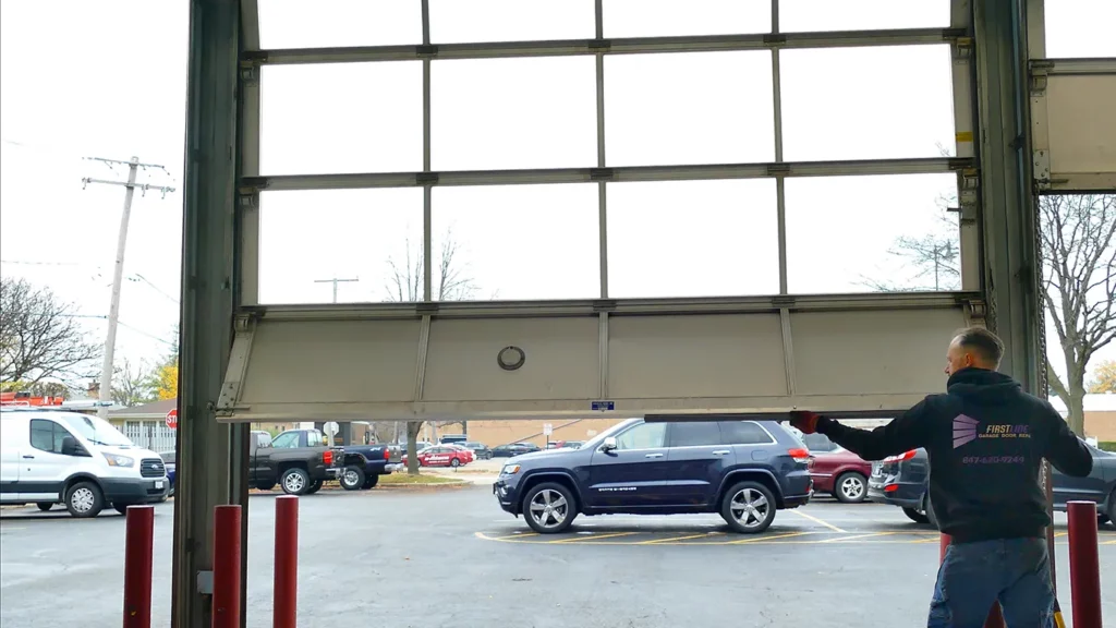 Technicians install a new garage door rubber band.