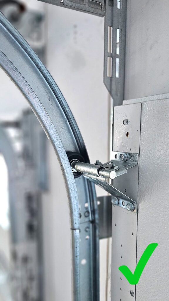 Properly installed track and smooth garage door operation.