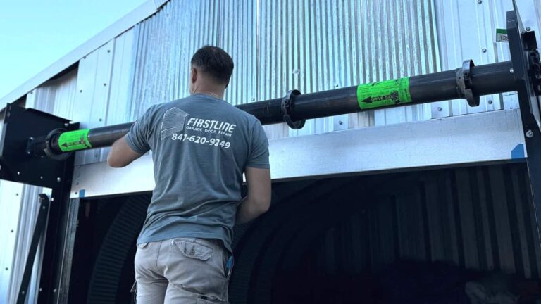 A technician is installing new rolling doors.