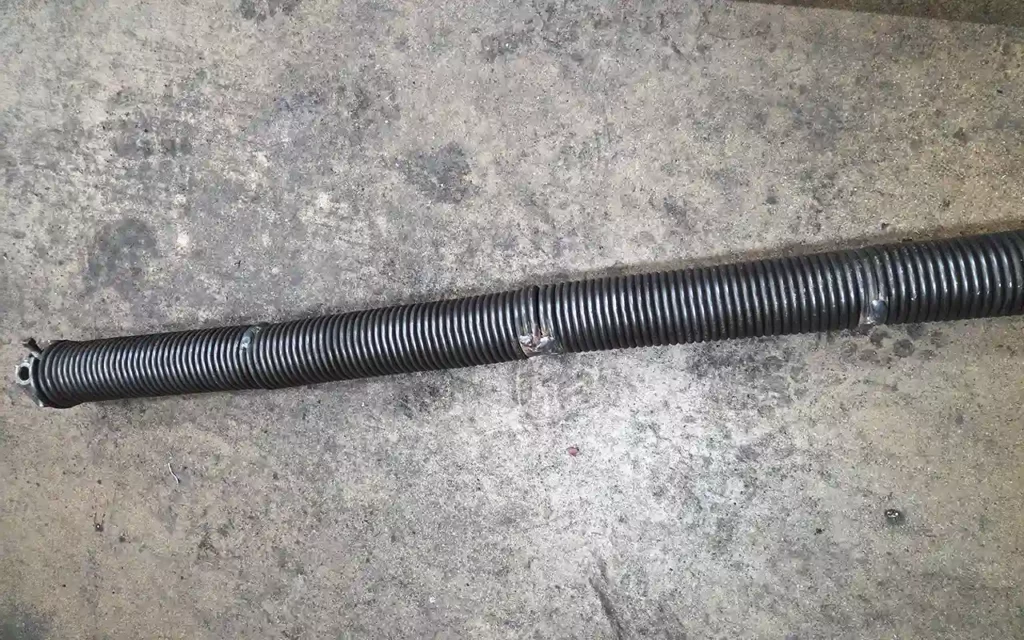 Welded Spring Garage Door Spring Repair Chicago IL | Same Day Service