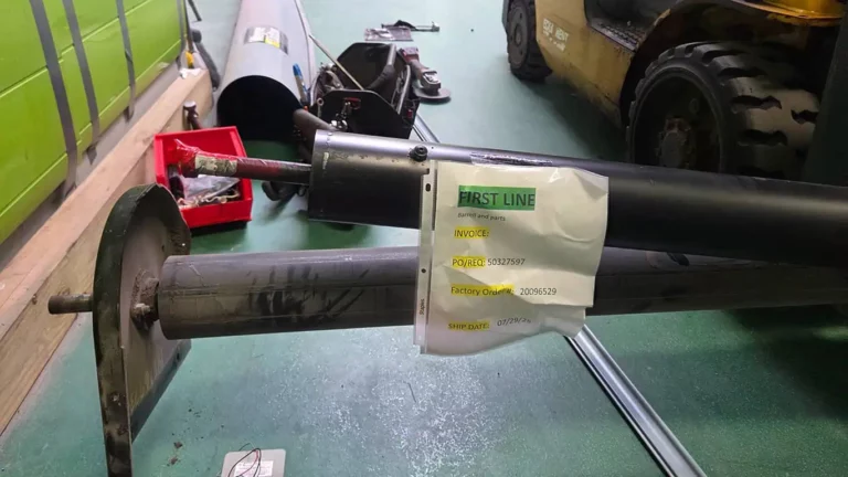 Commercial rolling door barrel replacement — Wheeling, Illinois. Both barrels are staged on a forklift, ready for installation.