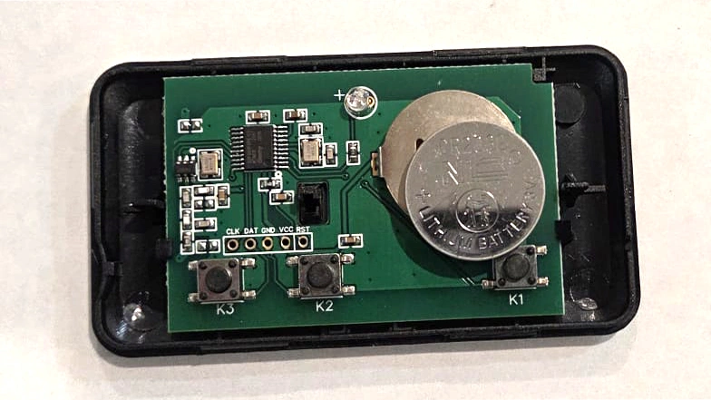 Remote cover is open, and the old battery has been removed.